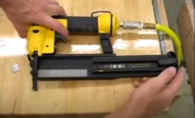 How to load a brad nail gun?
